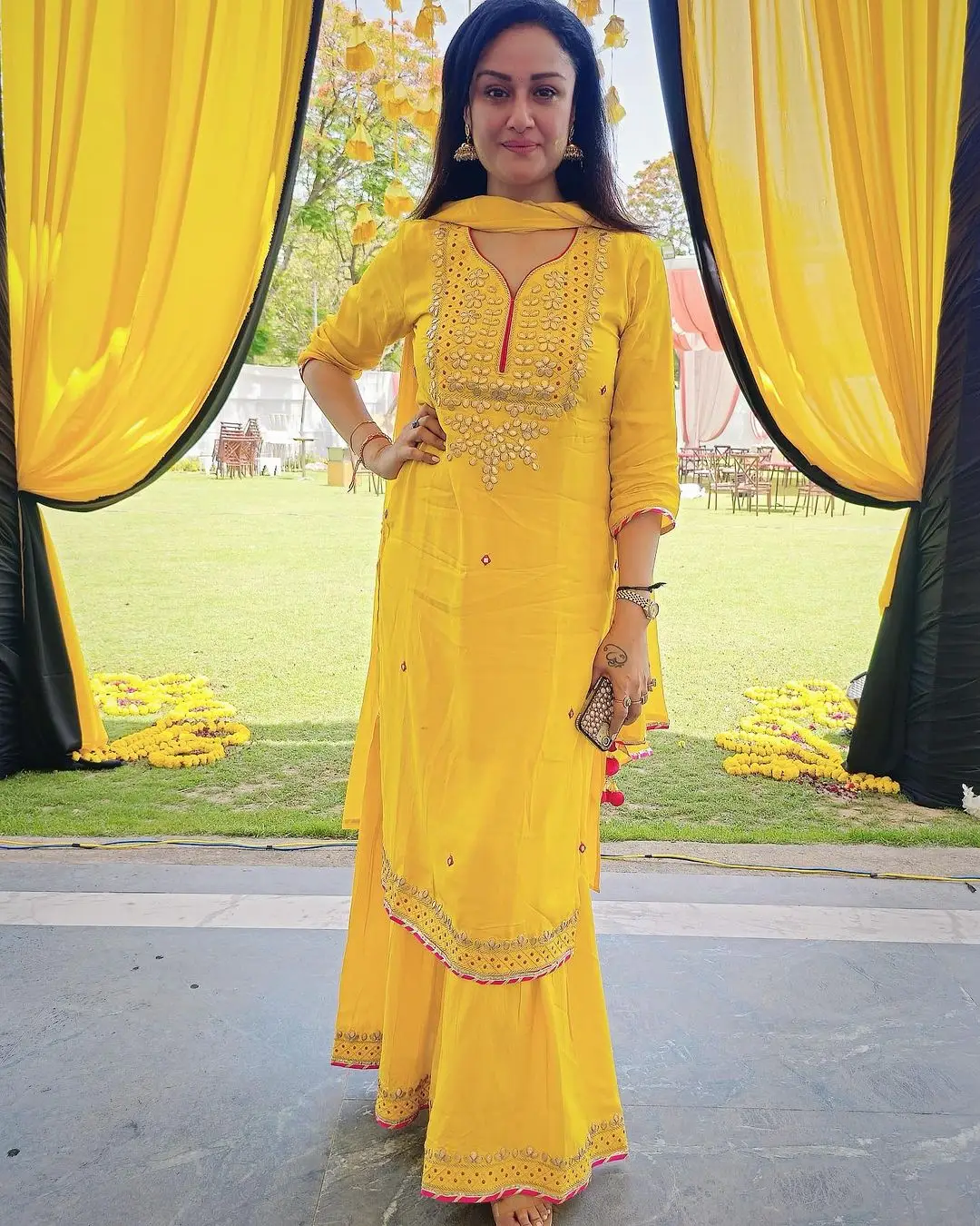 Sonia Agarwal Stills In Yellow Gown